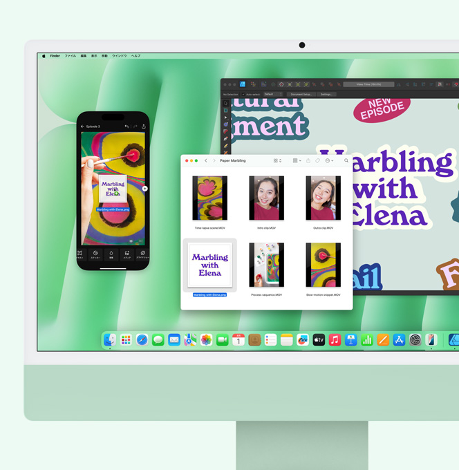 グリーンのiMac。iPhoneミラーリングが使われている。iMacから、ミラーリングされているiPhoneの画面にファイルがドラッグされている