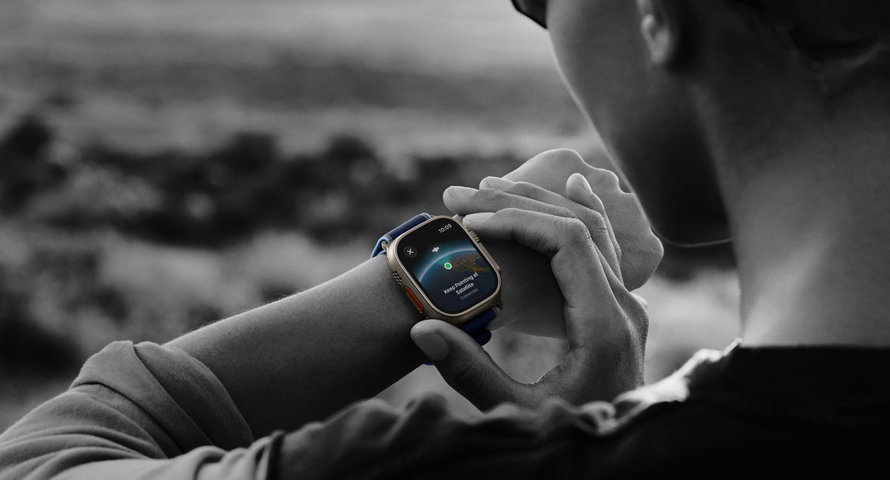 A person uses two-way satellite communication on Apple Watch Ultra 3 while hiking