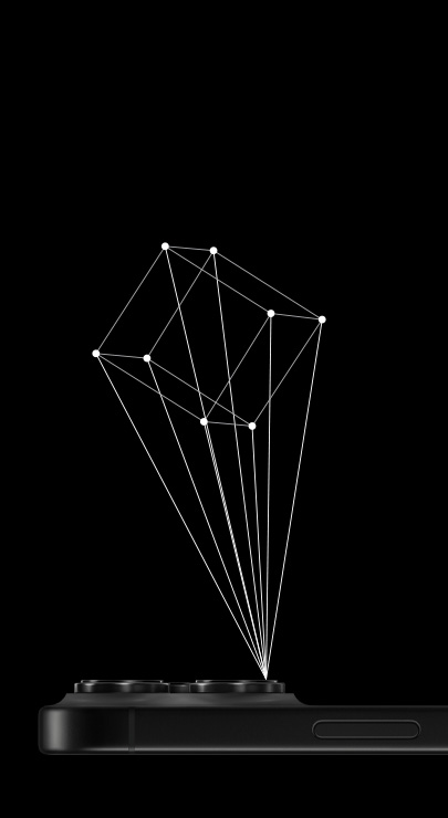 Ein iPhone liegt mit dem Display nach unten und projiziert mit dem integrierten LiDAR Scanner den Umriss eines 3D Würfels.