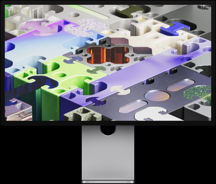 Vue avant du Studio Display XDR affichant un fond d’écran tridimensionnel de type puzzle