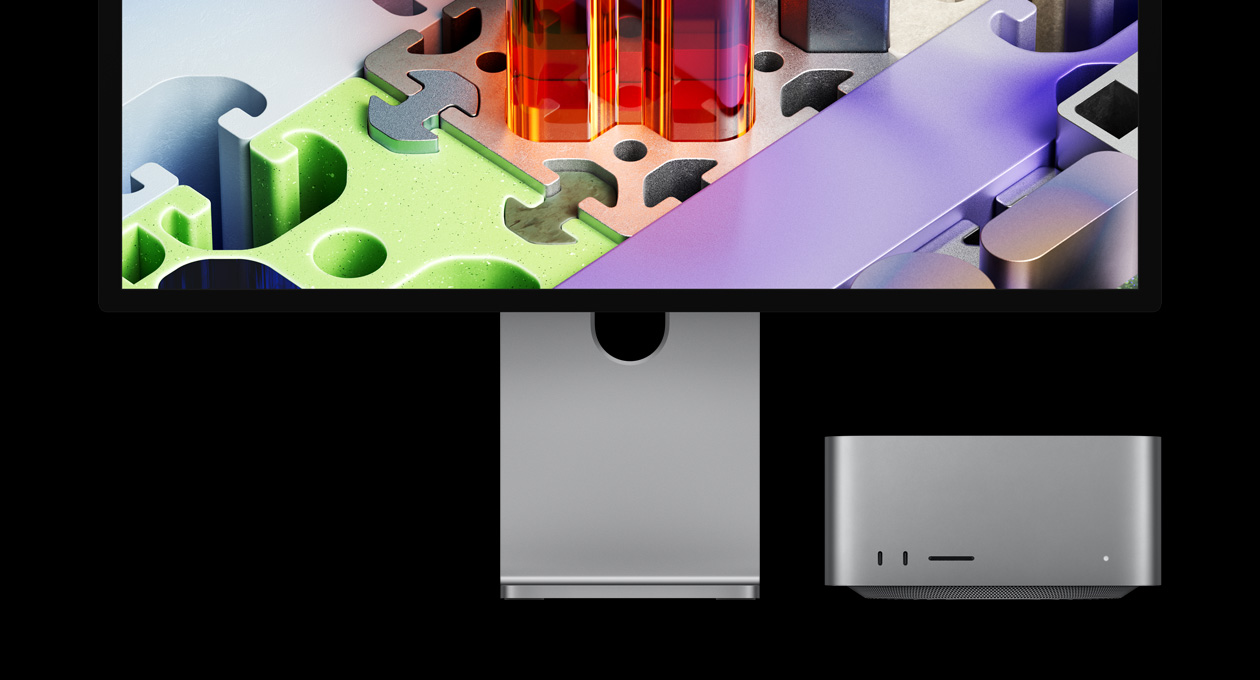 Mac Studio paired with Studio Display XDR, device tucked under screen: Studio Display XDR has a three-dimensional puzzle-like wallpaper